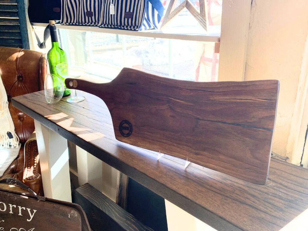 charcuterie board on display of an antique store shelf