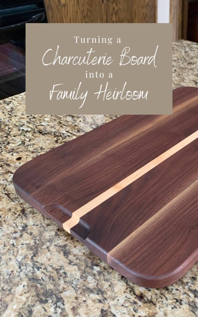 Pin image turning a charcuterie board into a family heirloom. Walnut cutting board on a granite countertop.